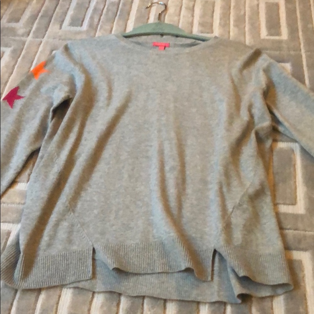 Grey sweater with stars on the sleeves